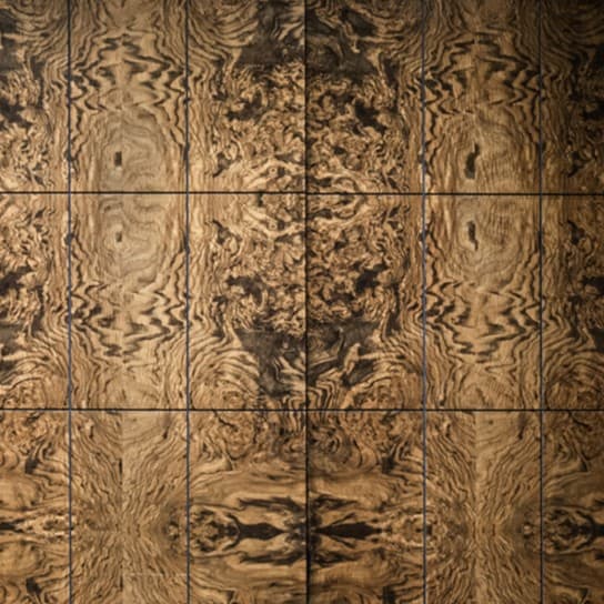 Book-matched olive burl veneer wall in warm browns