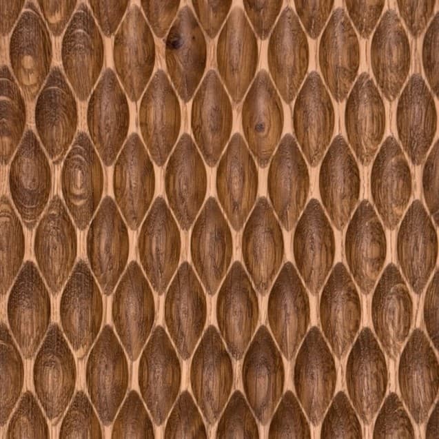 Carved walnut panel with a three-dimensional lens relief pattern